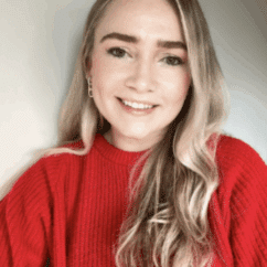 Kelly Hagler smiling at the camera against a white background.